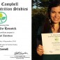 Sivan Pardo Renwick, the founder and director of The Vegan Woman, holding her Plant-Based Nutrition certificate from eCornell and the T. Colin Campbell Center for Nutrition Studies. Image: TVW.